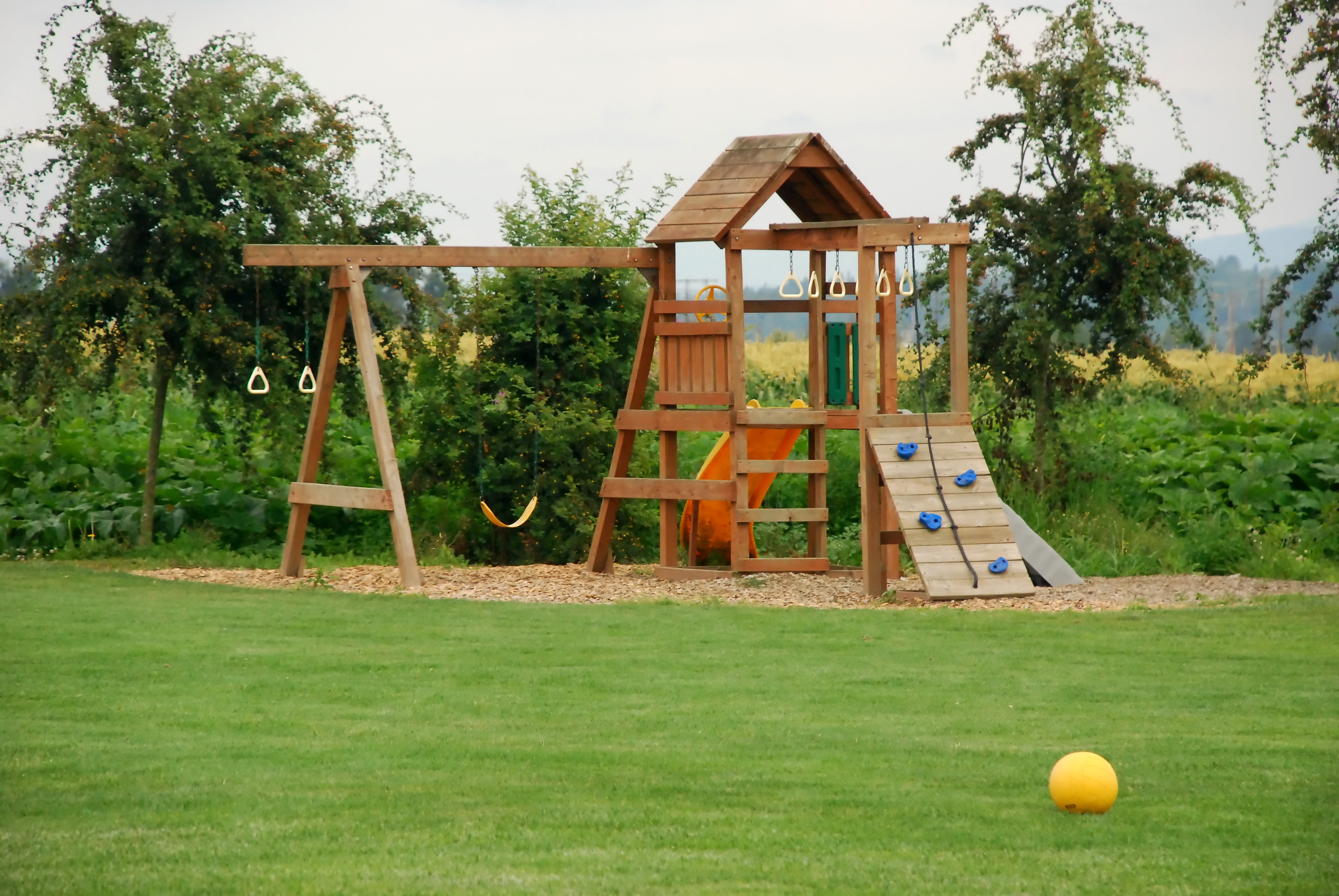 Backyard Play Area with Grass and Wood Chips