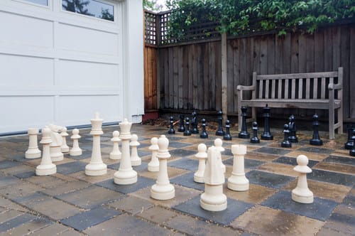 Outdoor Chess set on Paver Driveway