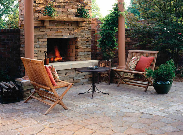 Pergola covering an outdoor fireplace area.