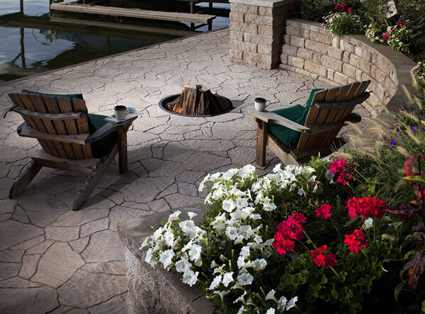 Lakeside patio area with in-ground fire pit.