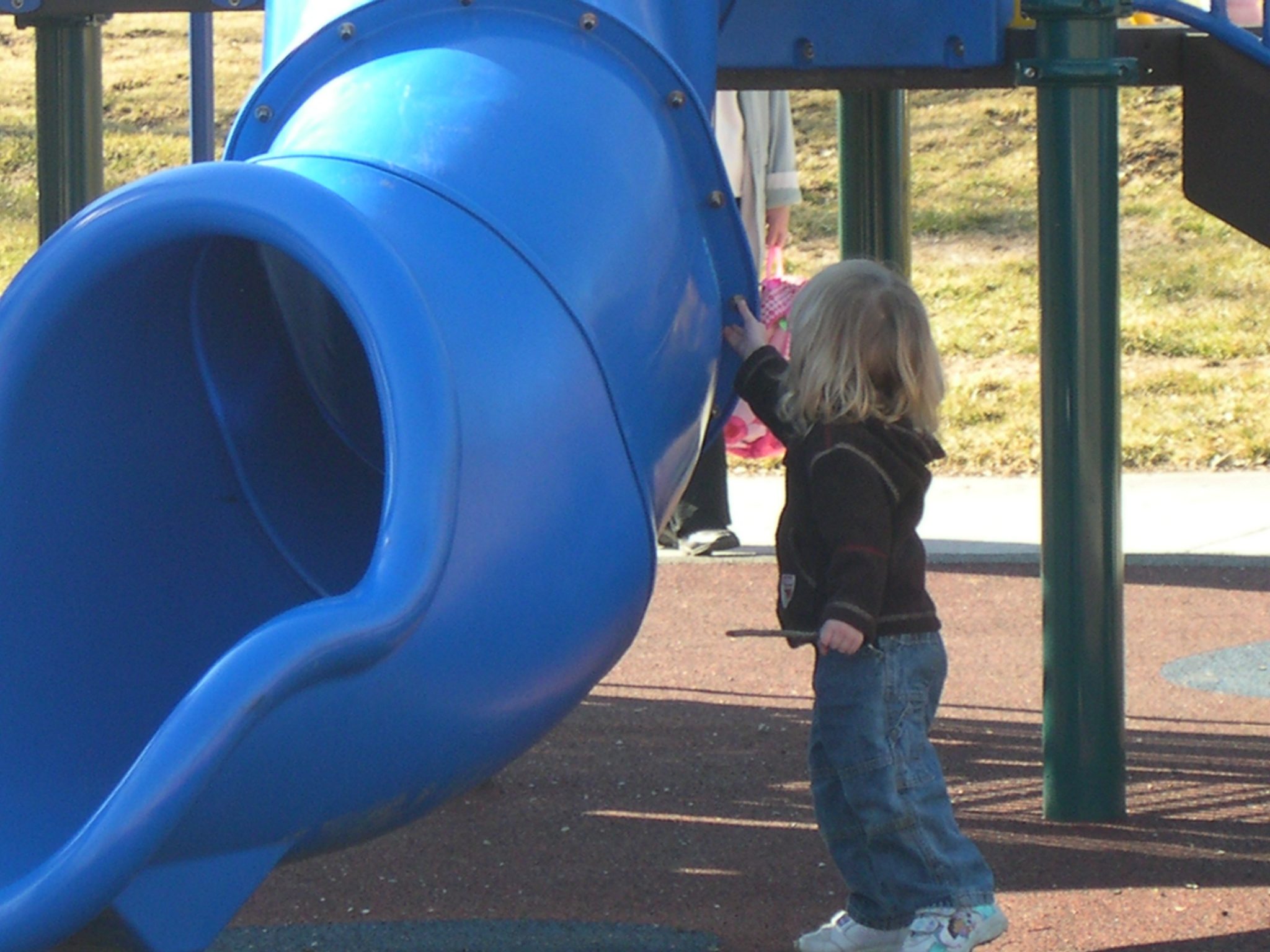Child Playing on Rubber Playground Surface