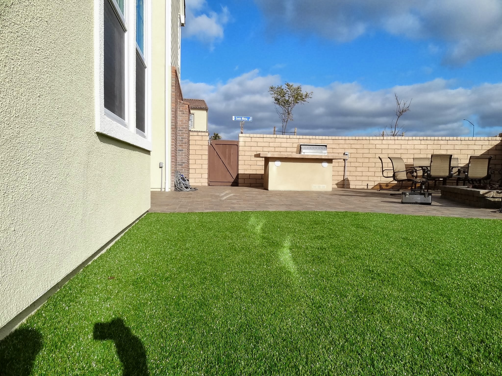 Low E Windows reflection on the synthetic turf