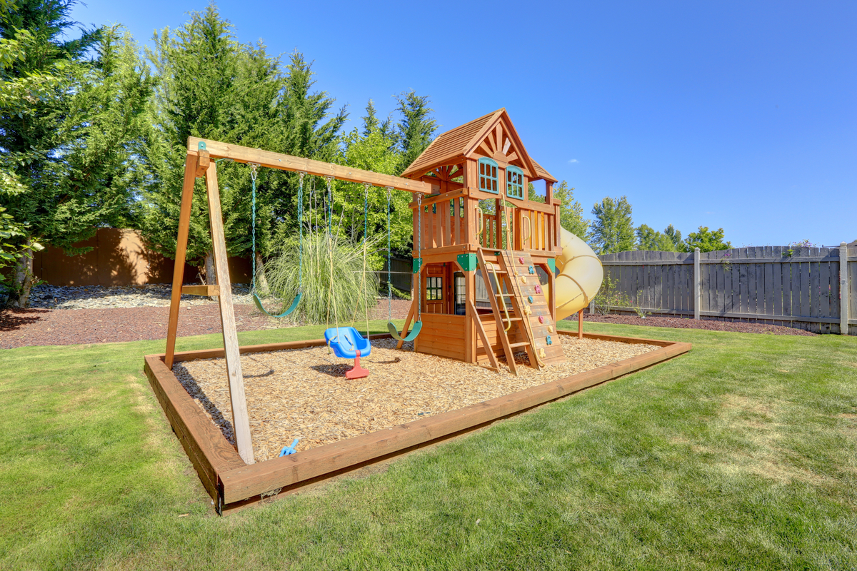 Backyard Landscaping with a playground area for kids