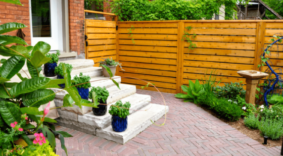 lay pavers in the right direction for bigger looking yard