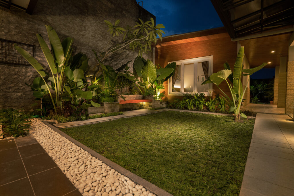 Palm plants and rock landscaping