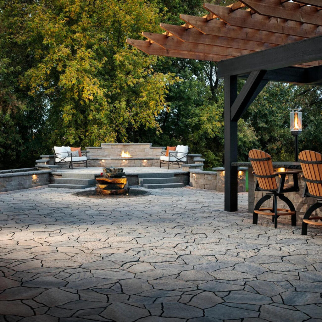 Hardscape landscape design in Santee, CA with an outdoor kitchen and fire pit. 
