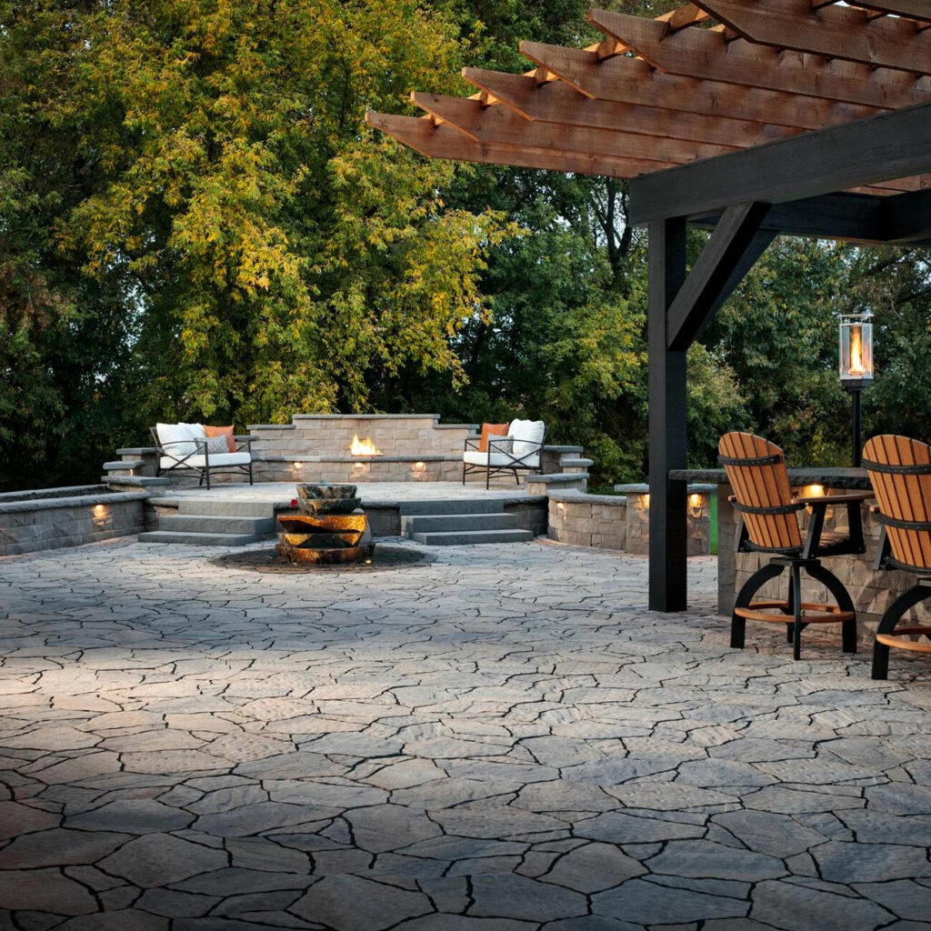 Hardscape landscape design in San Bernardo, CA with an outdoor kitchen and fire pit.