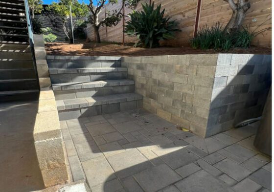 Garden wall and stone steps project at 92054
