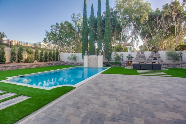 Wide pool and fireplace patio.