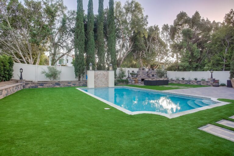 Pool corner and lawn.