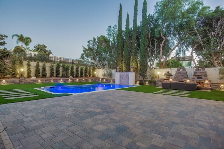 Wide twilight pool and patio.