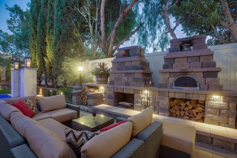 Seating beside the lit pizza oven.