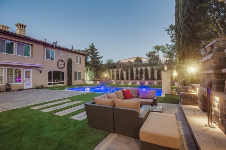 Lounge view to the lit pool.