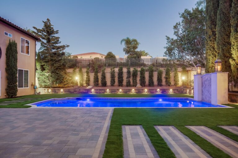 Twilight pool view toward the house.