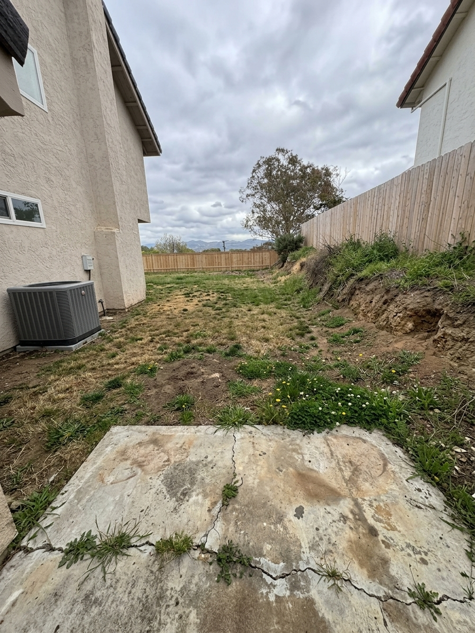 AI-generated before photo for Fletcher Hills El Cajon Paver Patio Fire Pit Artificial Turf - 1018-sf entertaining space with retaining walls (92020)