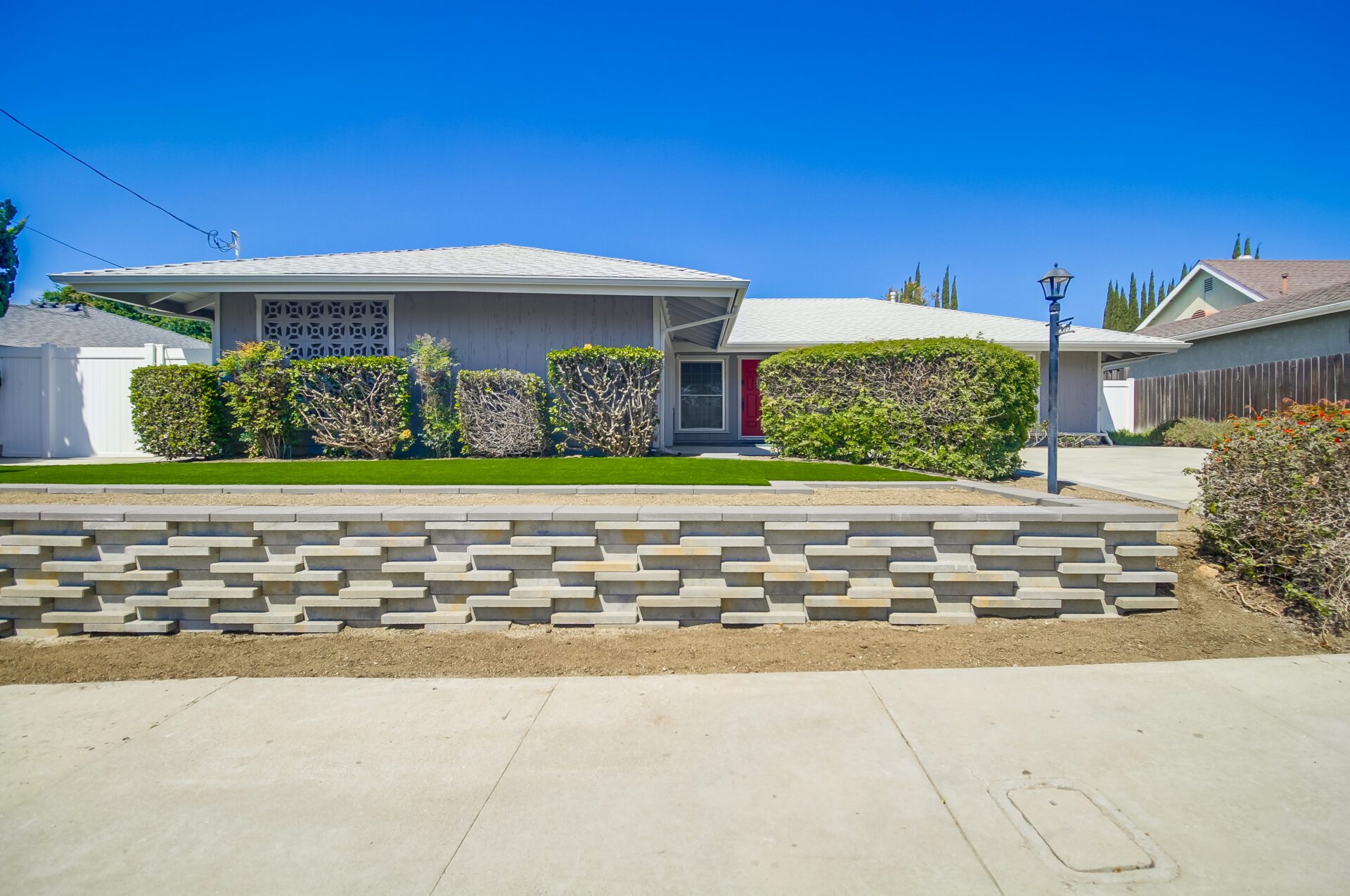 Street view of the stacked block retaining wall.