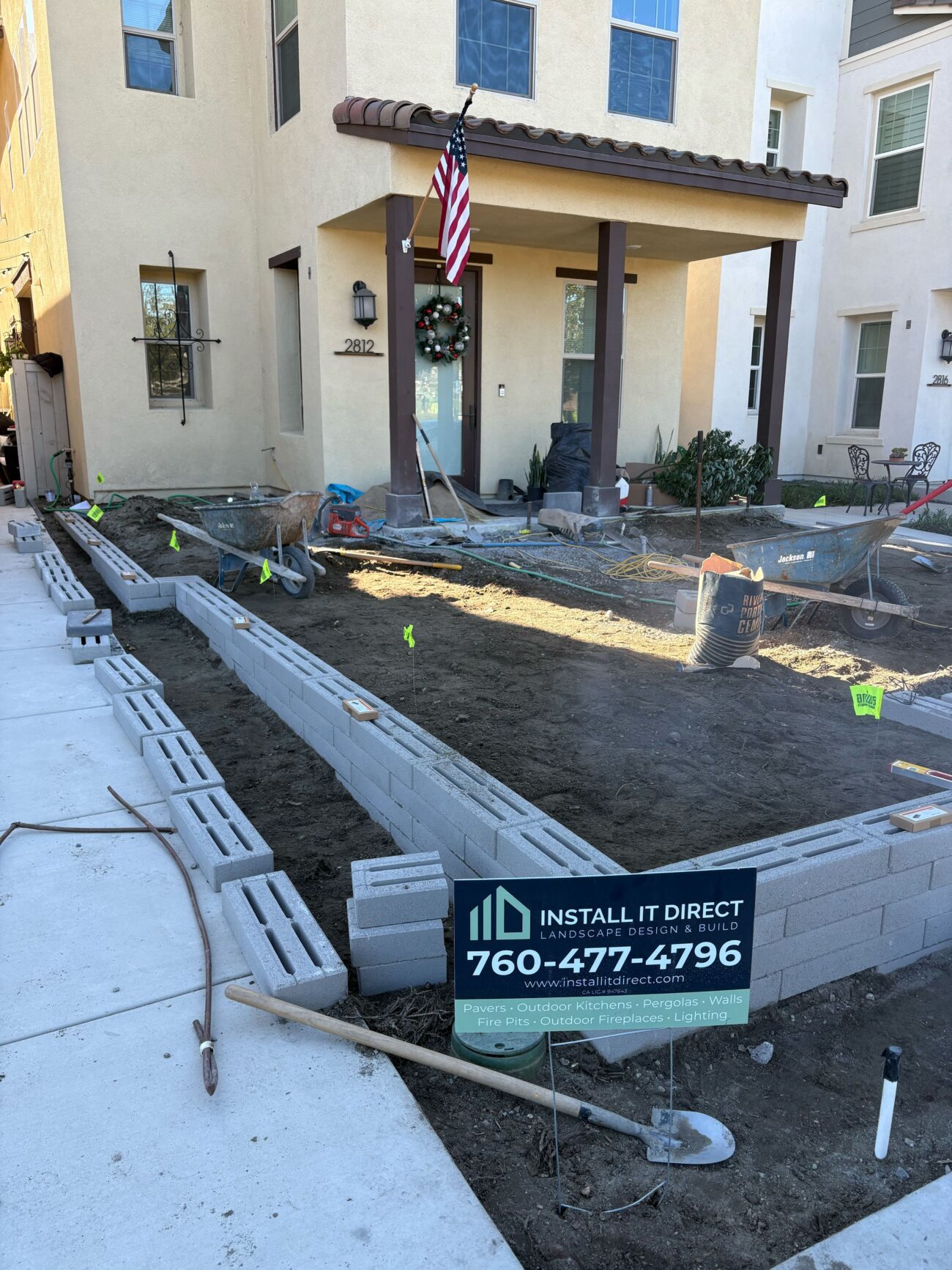 Close-up photo of a broken concrete slab edge with fragmented concrete rubble scattered onto adjacent soil. Escondido project by Install It Direct.