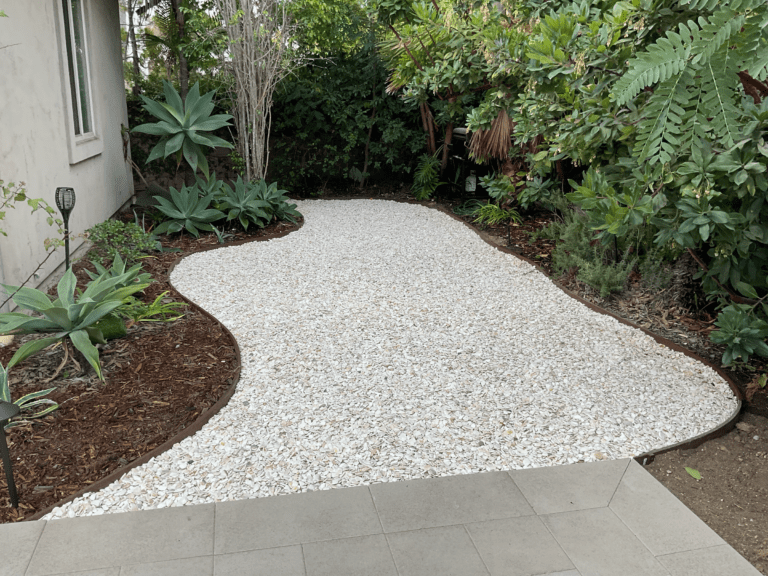 Completed backyard porcelain patio and retaining wall project in San Diego.
