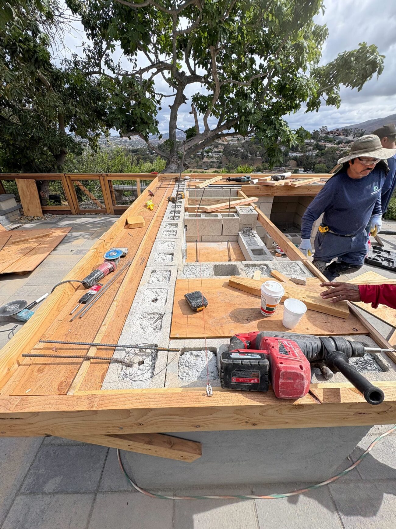 CMU block, rebar and wood forms define the outdoor-kitchen counter before concrete.