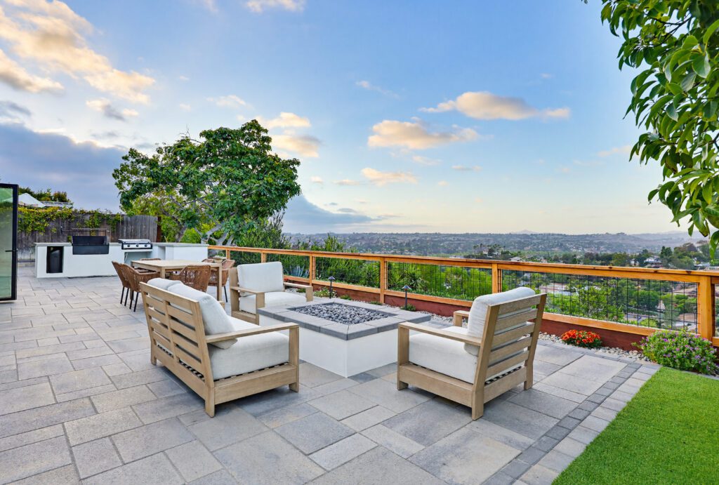 A paver patio with a fire pit and outdoor kitchen, built by Install-It-Direct in Bonita