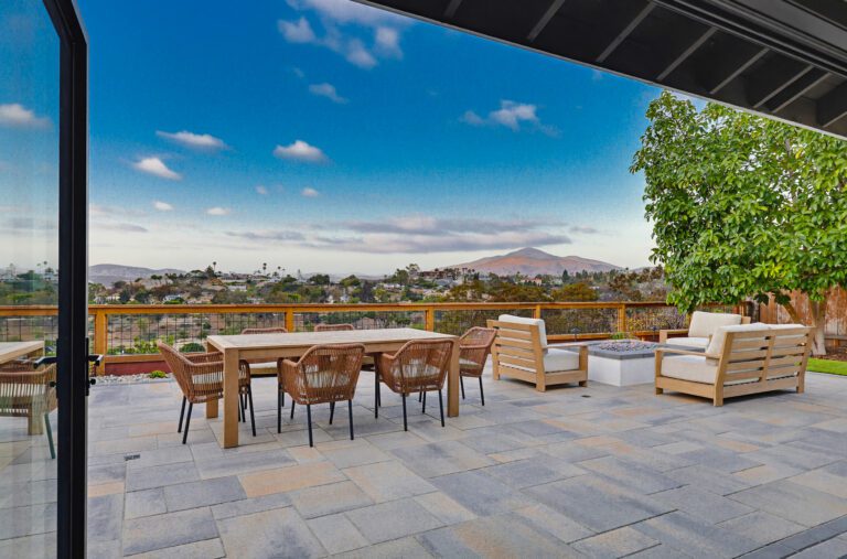 Paver patio opens to the home through the existing folding-glass wall