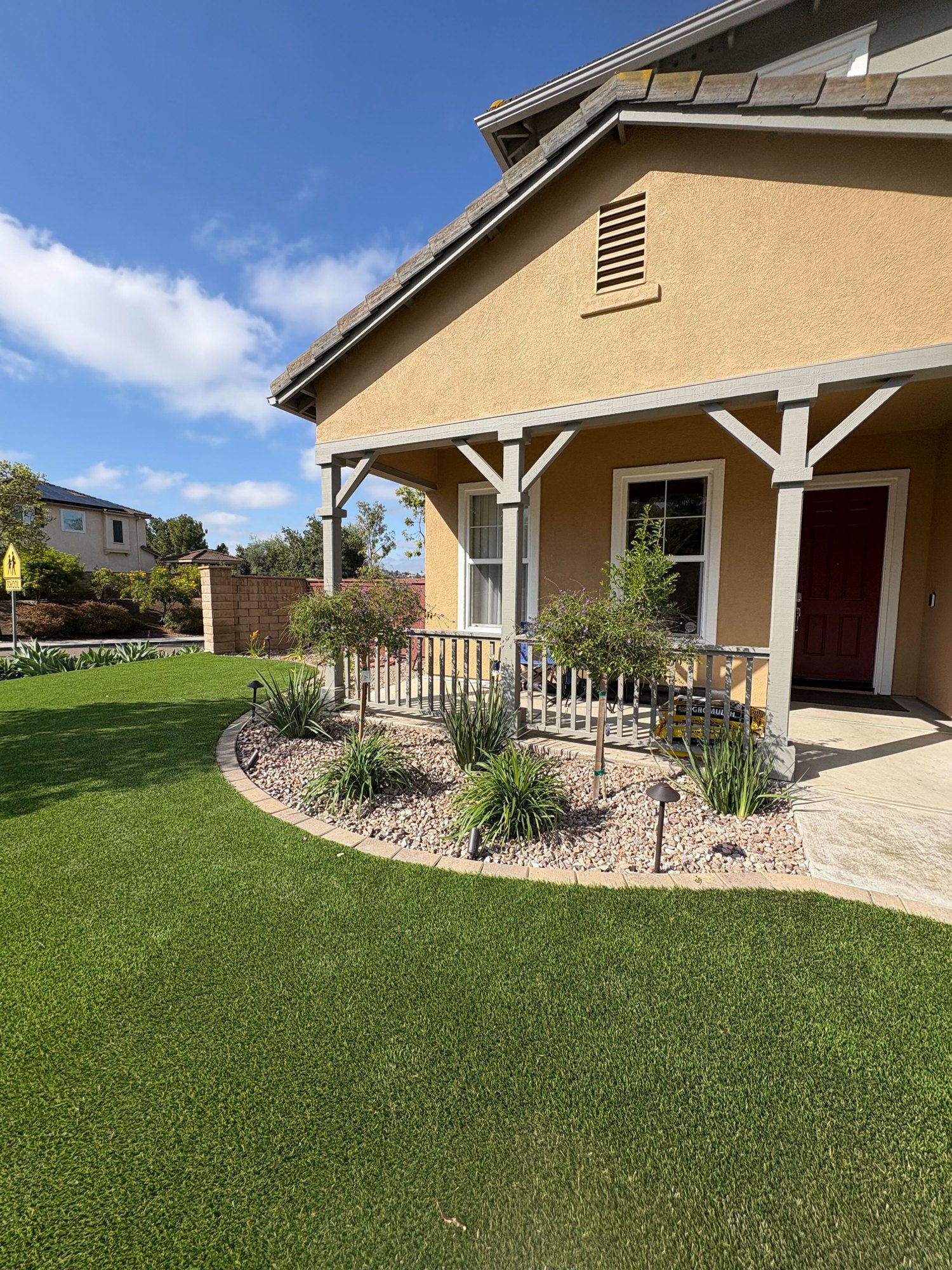 New turf and a refreshed front planter with low-voltage path lights