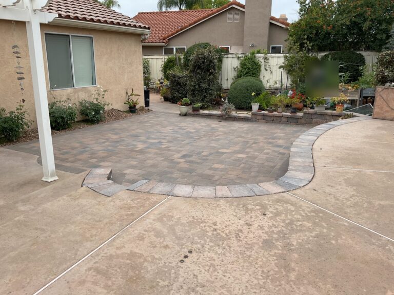 Paver patio with a curved wall border beside the pergola, Poway 92064