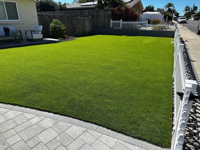 About 930 square feet of turf inside the new picket fence