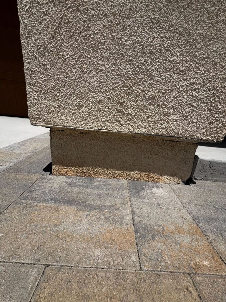 Pavers cut to fit around the base of a column
